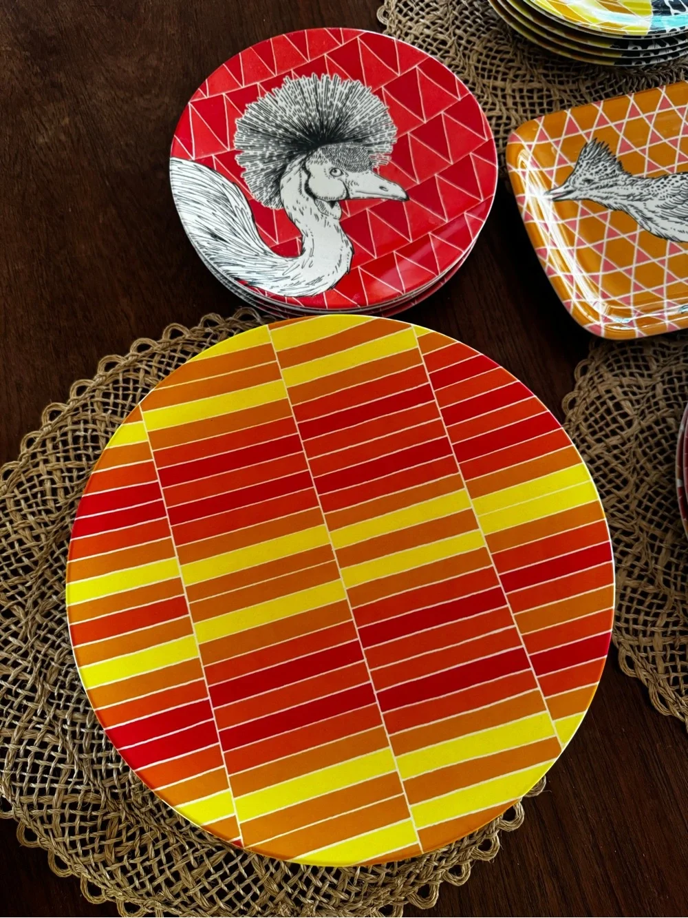 Set of 38 West Elm plates with colorful geometric prints & animal illustrations